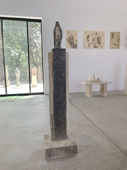 Jane Rosen Sebastian_s Tea a carved stone bird on pedestal at Seager Gray Gallery in Mill Valley CA in the San Francisco Bay Area